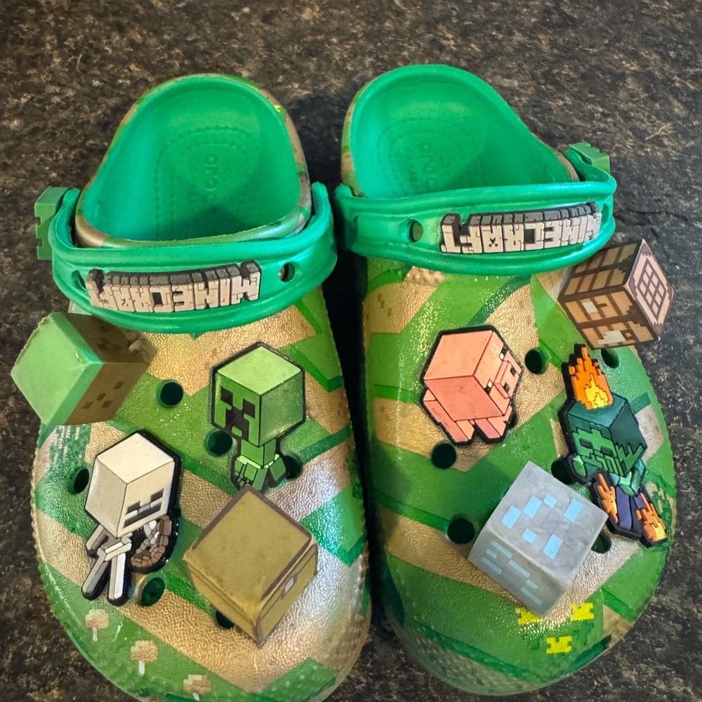 CROCS Green Slippers with Playful Design